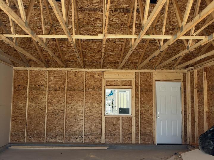 The inside of a framed garage